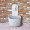 fontaine murale avec tête de lion, pierre artificielle